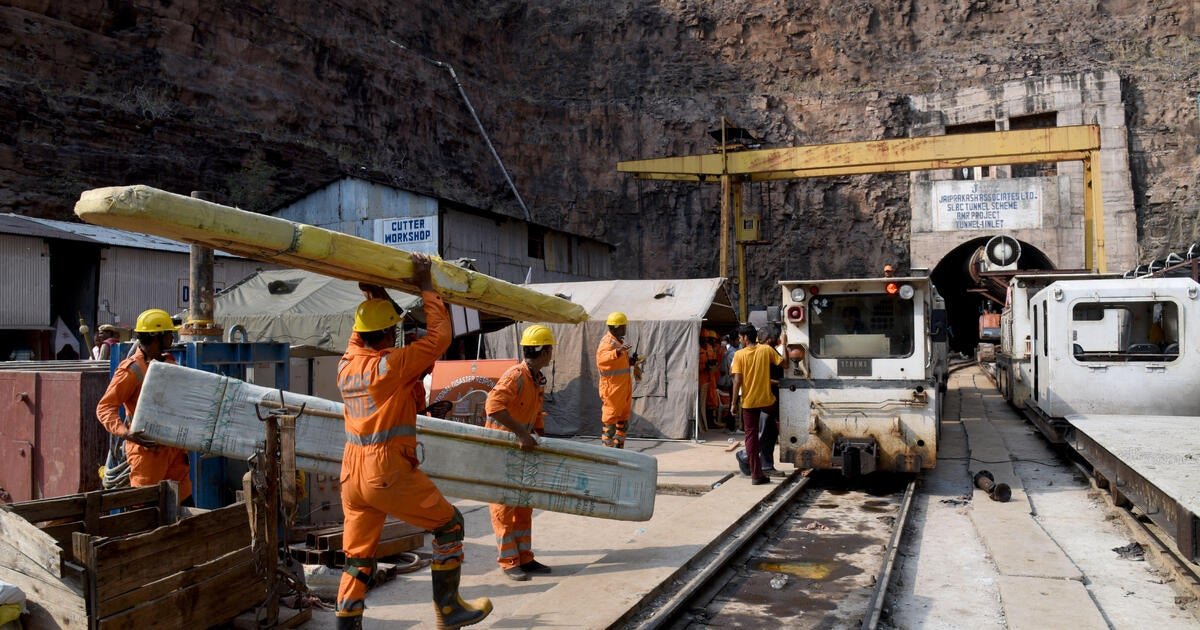 India tunnel collapse sparks race to find 8 trapped workers, but chances of survival deemed “very remote”
